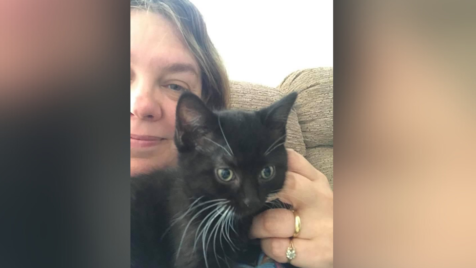 Jo Underwood with a black foster cat