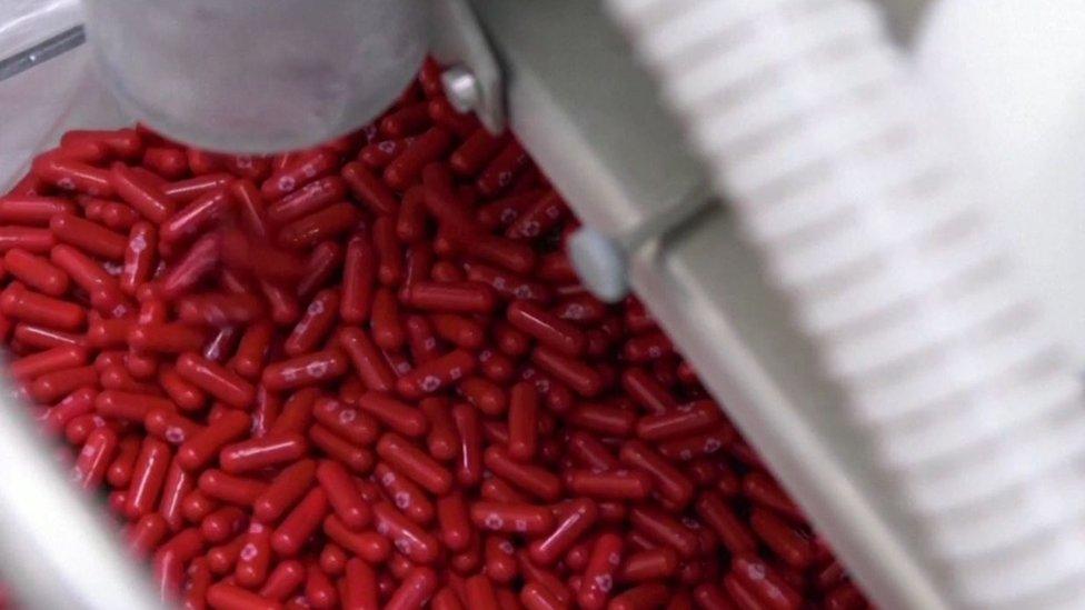 pills being shot out of a pill machine