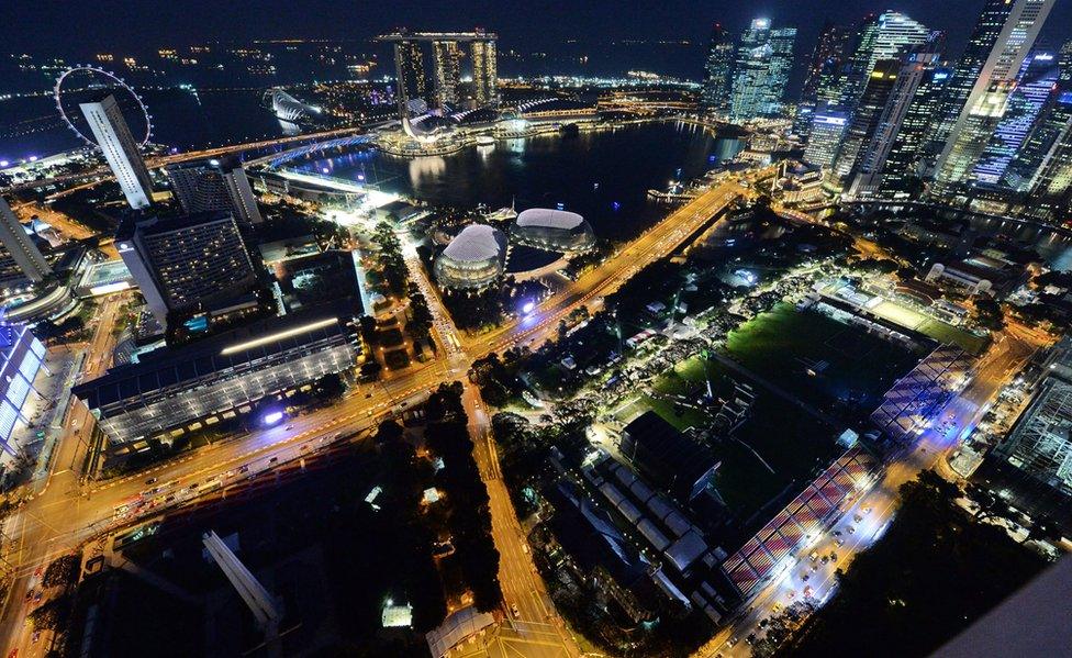 An aerial view of Singapore lit up at night