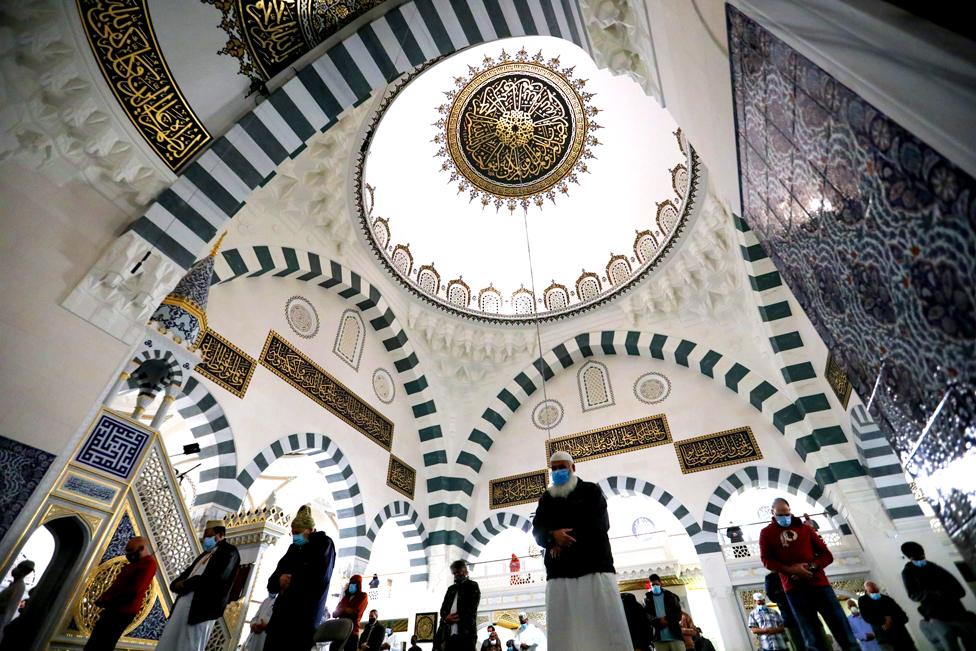 Muslim worshippers pray in a mosque