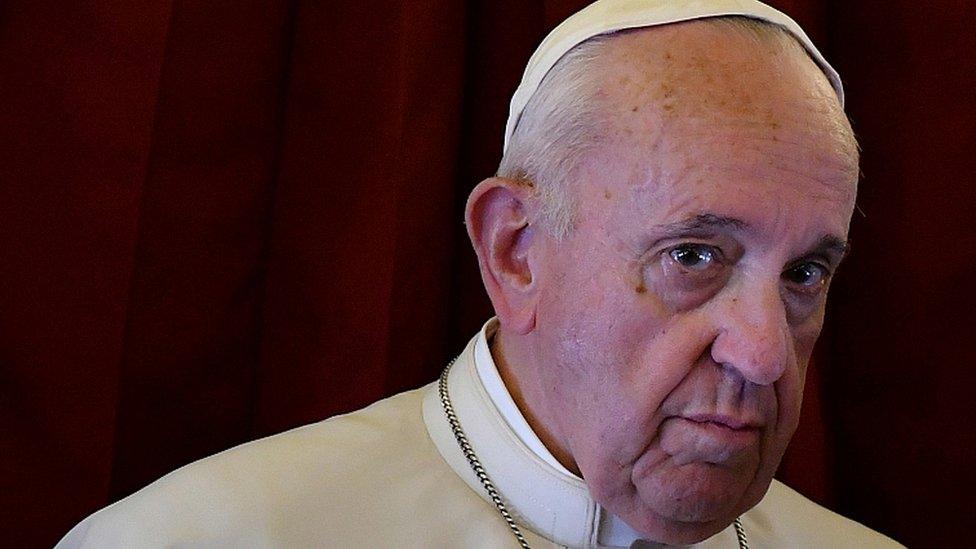 Pope Francis looks on as he addresses reporters aboard the plane bringing him back following a two-day trip to Morocco March 31, 2019