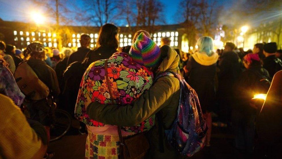 Members of the public attend a candlelit vigil at College Green in Bristol city centre