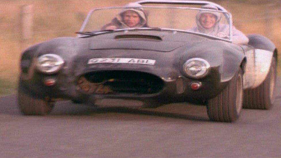 The Lewis twins driving an AC Cobra