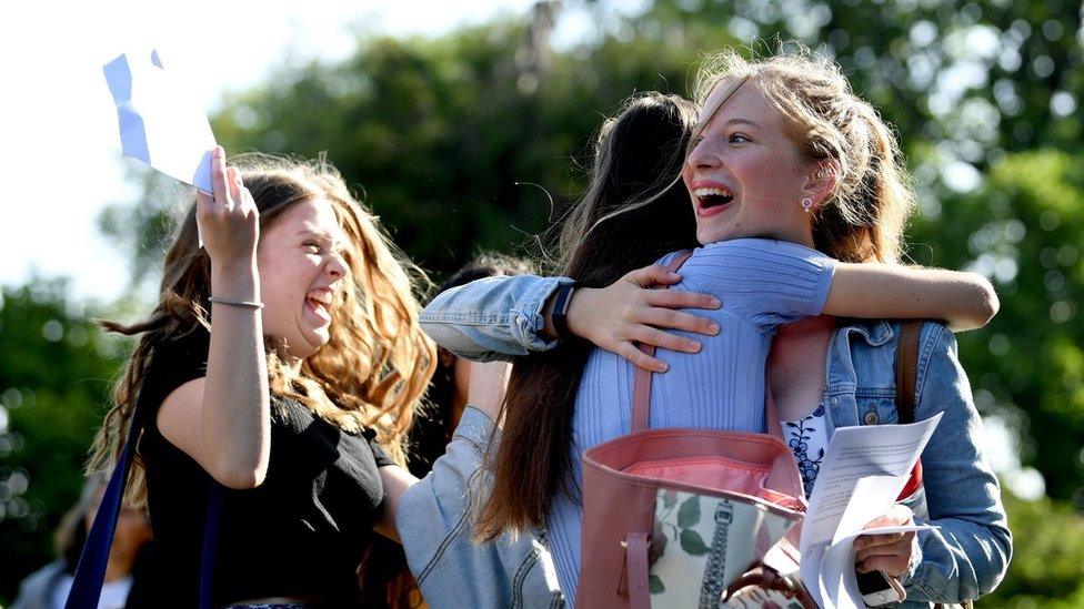 Grace Murray (left) and Lucy Garside celebrate with their GCSE results at Norwich School in Norwich, Norfolk.