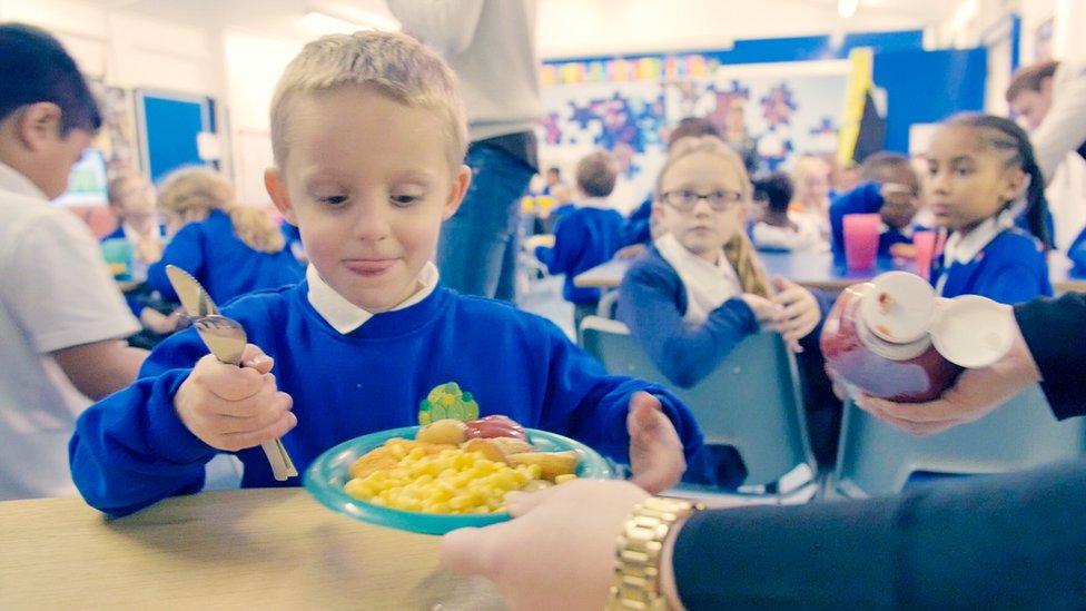 Schoolchildren having dinner