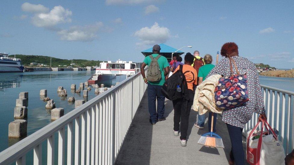 Barbudans board the boat home