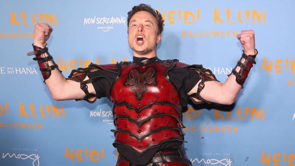 Elon Musk posing in costume at Heidi Klum's 2022 Halloween Party