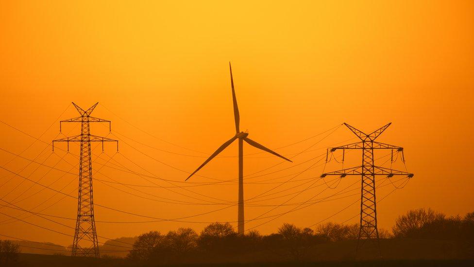 Pylons and wind turbine