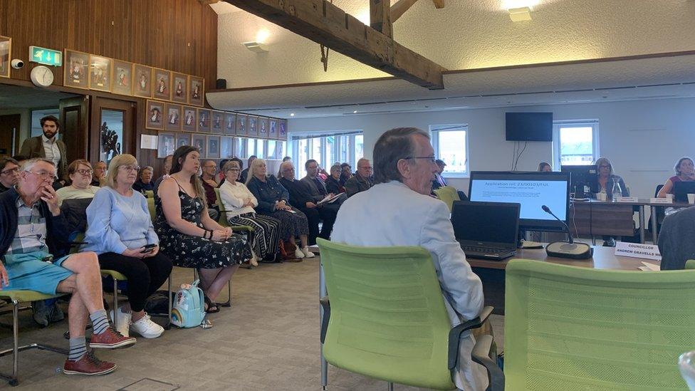 Residents and councillors in a Gloucester City Council meeting