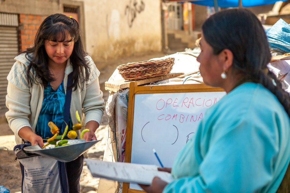 Keyla Guzman Velez teaching basic maths in the Rodriguez market