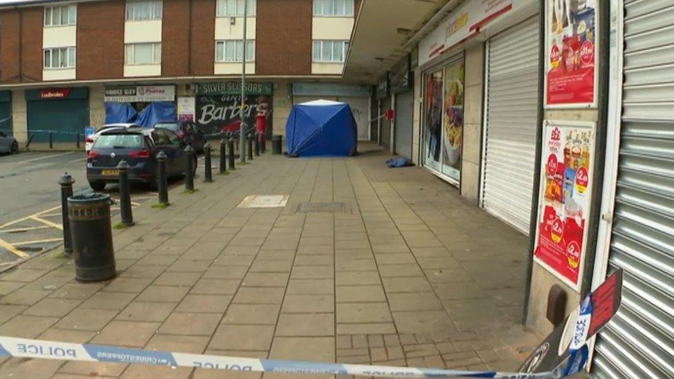 Blue tent in police cordon