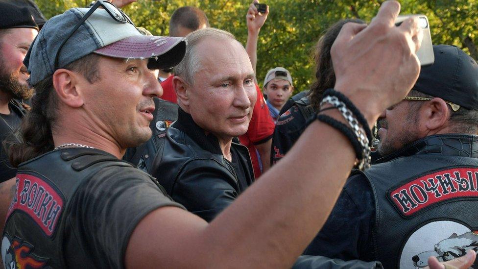 Russia's President Vladimir Putin greets participants of a bike show organized by motorcycling club "Night Wolves" in Sevastopol, Crimea on 10 August 2019