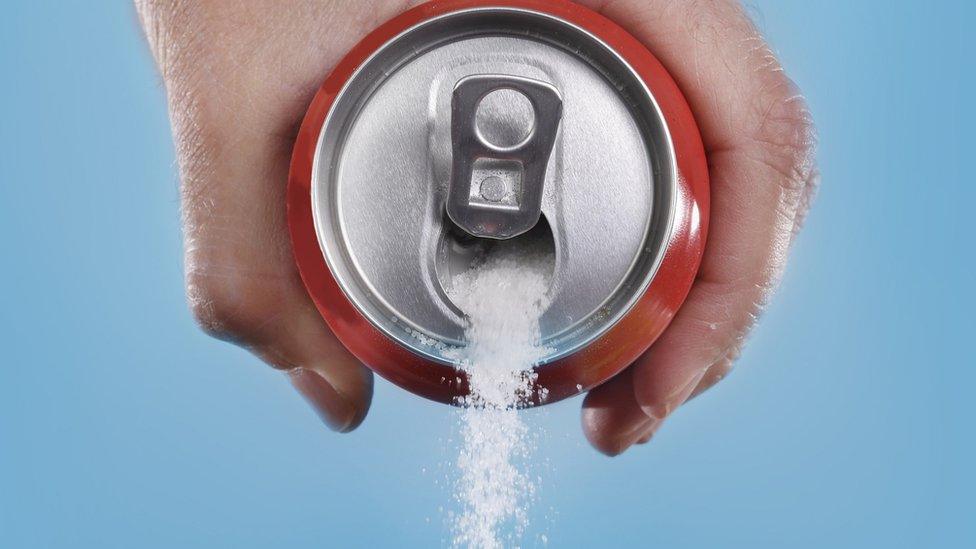 Sugar pouring out a can