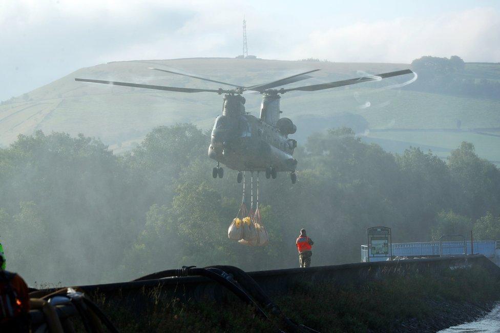 Chinook hovers over dam