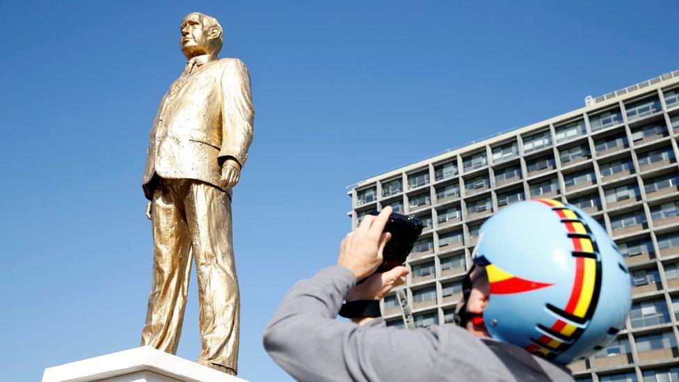 Man takes photo of statue of Israel's Prime Minister Netanyahu created by artist Zalait as a political protest outside Tel Aviv's city hall