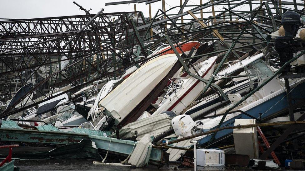 A warehouse of boats is damaged at Treasure Island Marina after Hurricane Michael made landfall along the Florida Panhandle, 10 October 2018