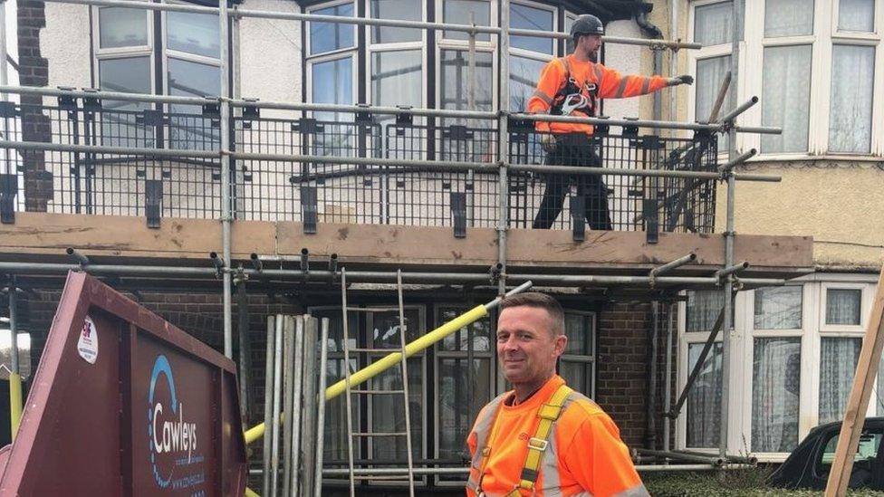 Scaffolders outside a house