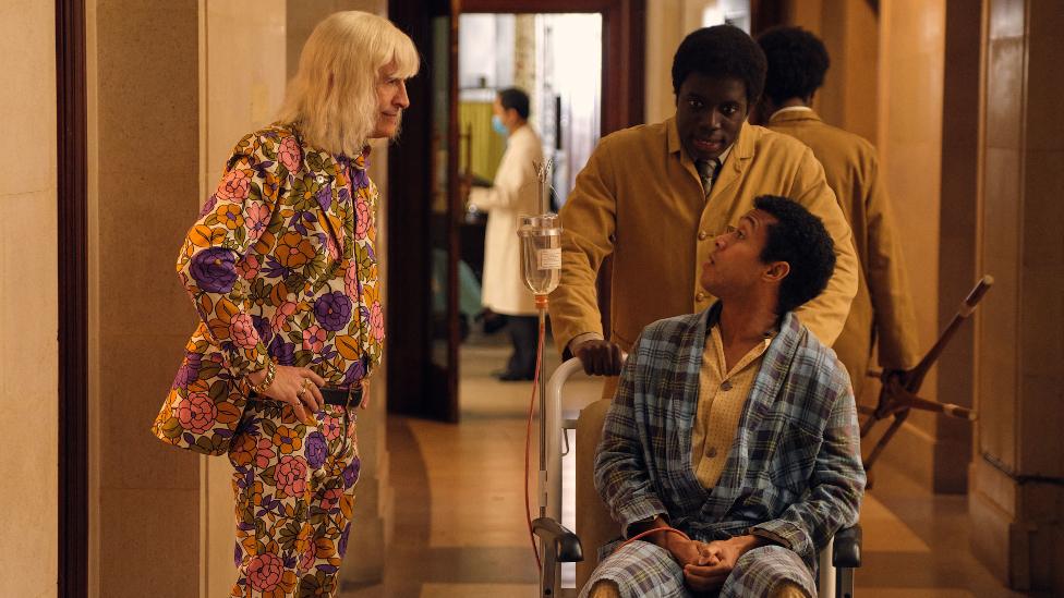 Steve Coogan as Jimmy Savile, visiting a hospital