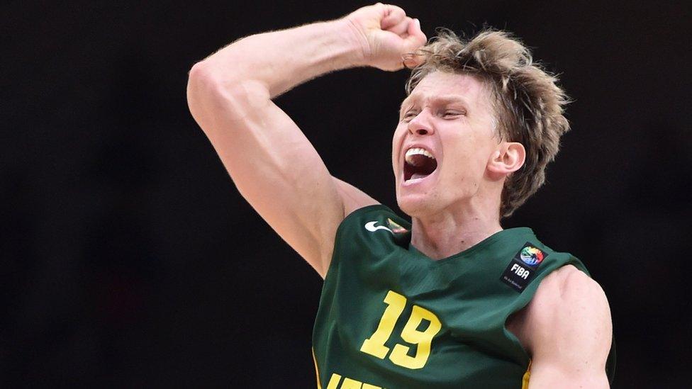 Mindaugas Kuzminskas playing basketball for Lithuania