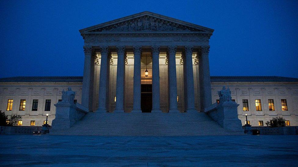 The US Supreme Court at night.