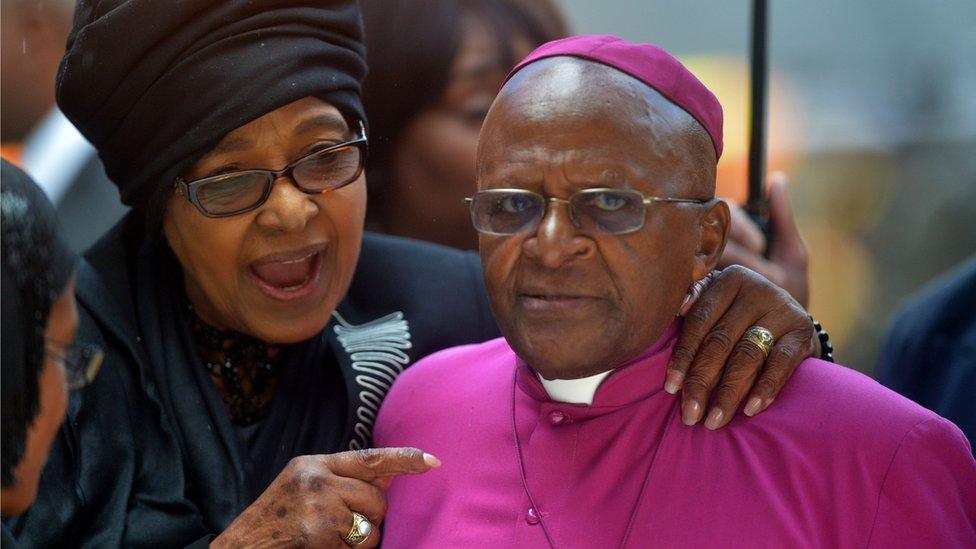 elson Mandela's former wife Winnie MadikizelaMandela speaks with South African Archbishop and Honorary Elders Desmond Tutu during the memorial service of South African former president Nelson Mandela at the FNB Stadium (Soccer City) in Johannesburg on December 10, 2013