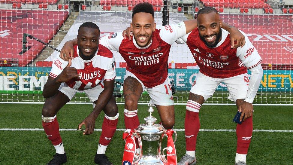 (L-R) Nicolas Pepe, Pierre-Emerick Aubameyang and Alex Lacazette of Arsenal celebrate after the FA Cup Final match between Arsenal and Chelsea at Wembley Stadium on August