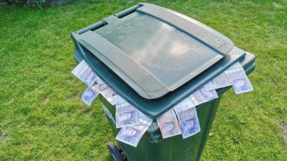 Bin with money in it