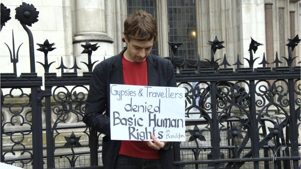 Man holding sign