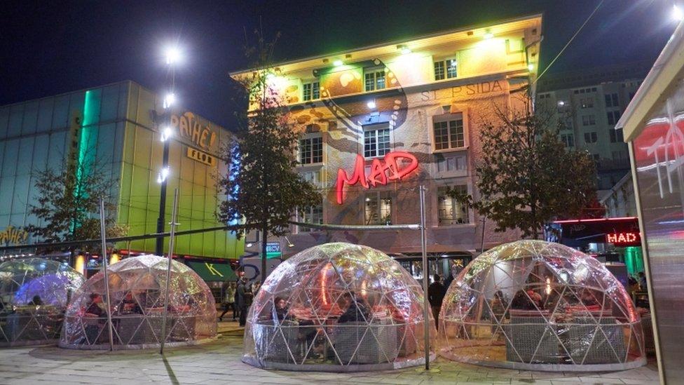 People sit in bubbles at a restaurant during the outbreak of the coronavirus disease (COVID-19) in Lausanne, Switzerland, December 17, 2020.