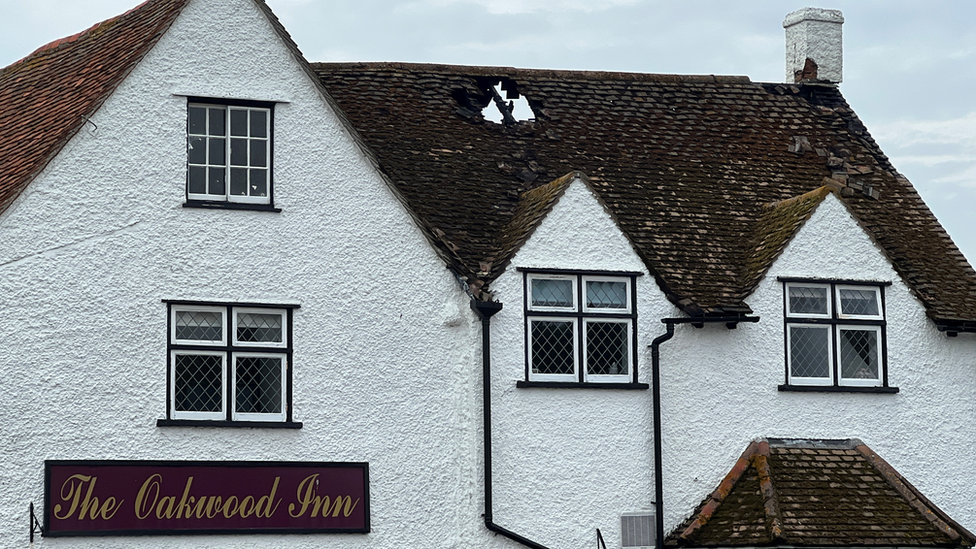 The damaged roof of Oakwood Inn