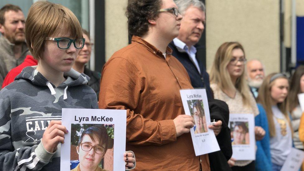 Several dozen people attended a vigil organised by Mid Ulster Trade Union Council in Cookstown holding photos of Lyra McKee and the message: “We Stand with Lyra”