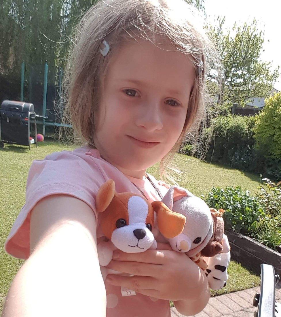 Isobel from Cheshire is chilling out in the garden with her favourite cuddly toys, Patch and Bessie