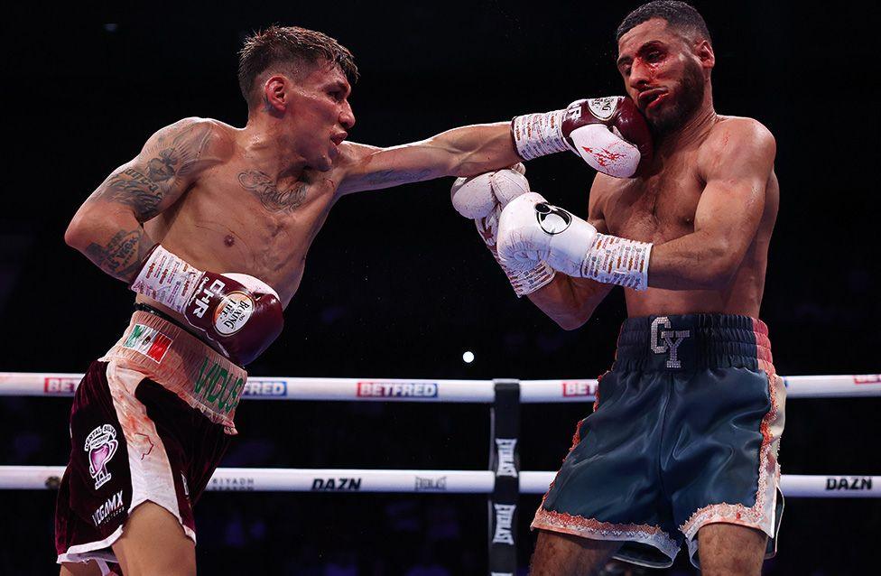 Francisco Rodriguez Jr punches Galal Yafai for the interim WBC super flyweight title at BP Pulse Live in Birmingham. Photo by Mark Robinson
