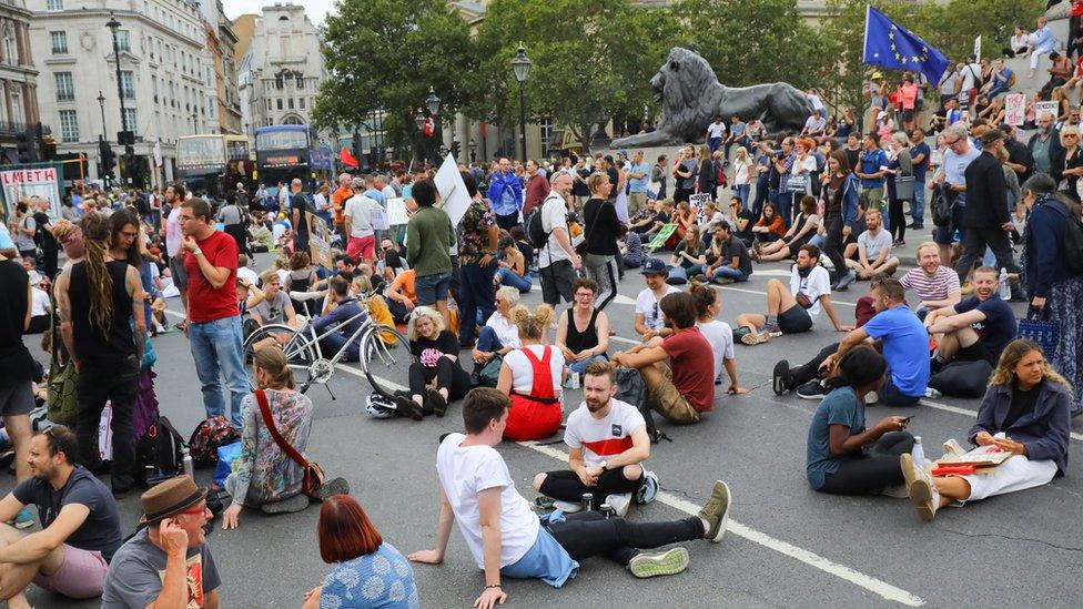 Anti Brexit protesters block the road and stop traffic in Trafalgar Square following a protest against Brexit and the prorogation of parliament in London,