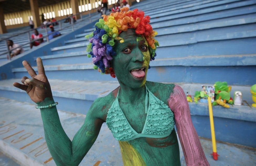 A Congolese fan cheers before the start of the 2019 AFCON group G qualifier match between Liberia and Congo at the Samuel Kanyon Doe Sports Complex in Paynesville, outside Monrovia, Liberia