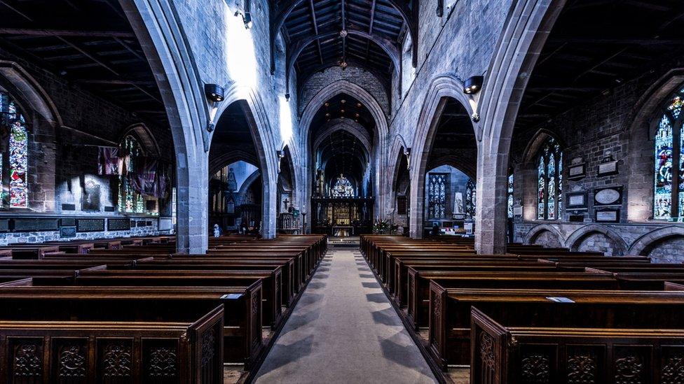 The wooden pews and the interior of Newcastle Cathedral