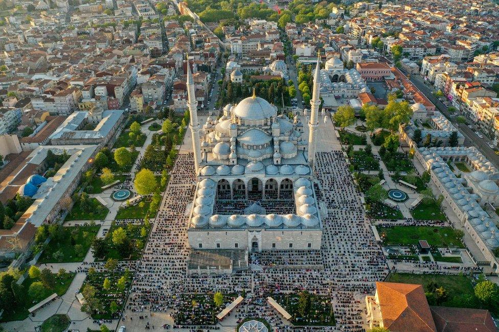 A drone photo shows an aerial view of the Fatih Mosque as hundreds of people gather to perform Eid al-Fitr prayer in Istanbul, Turkey