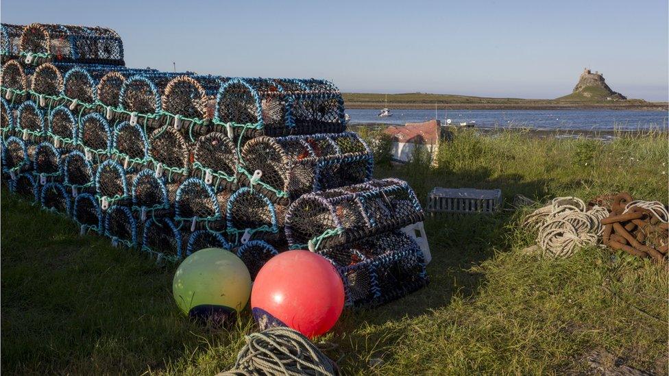 Fishing pots and Lindisfarne Castle on Holy Island