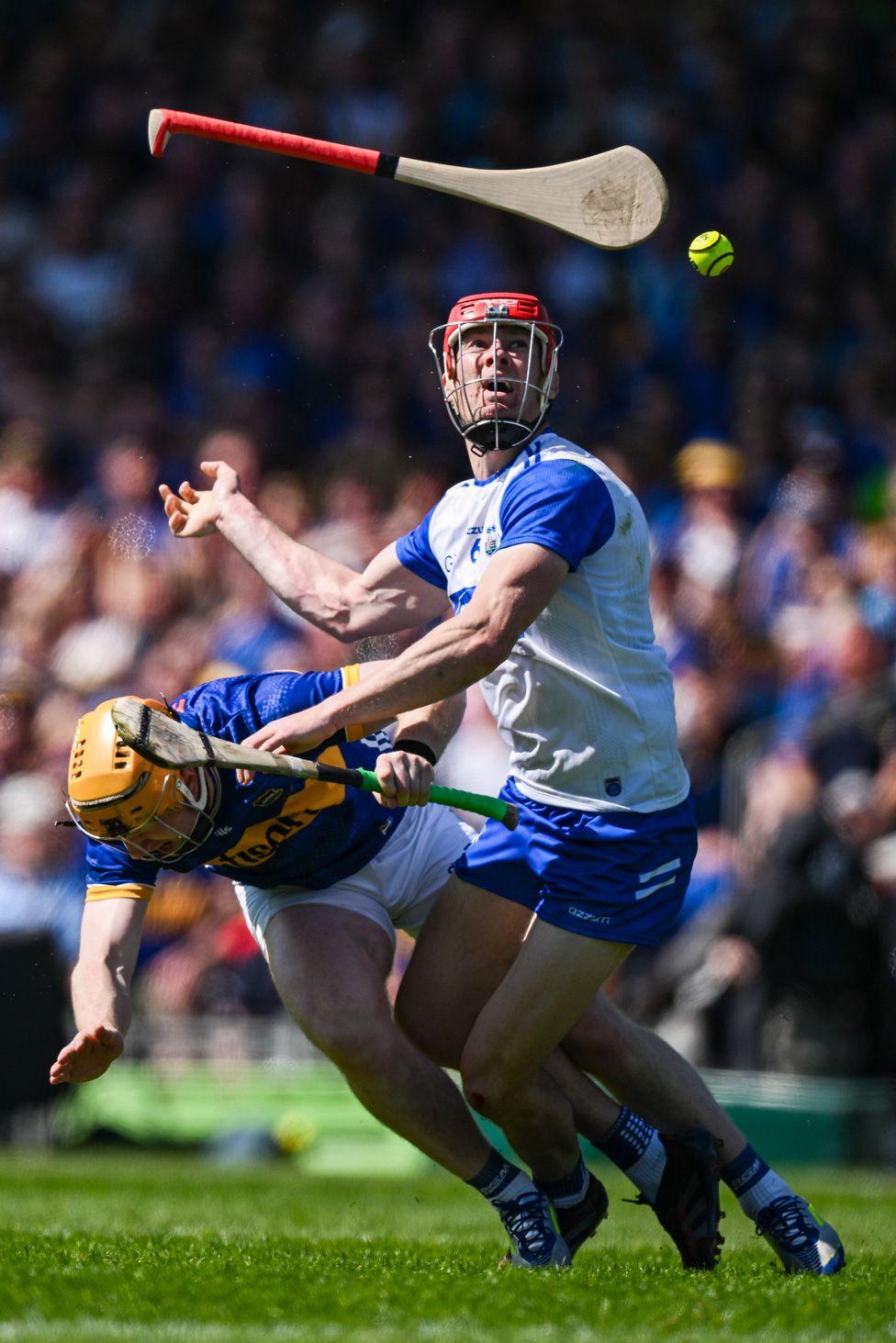 Jake Morris of Tipperary loses grip of his hurley as he's tackled by Tadgh de Burca of Waterford during a Munster GAA Hurling Senior Championship match. Photo By Ray McManus/Sportsfile