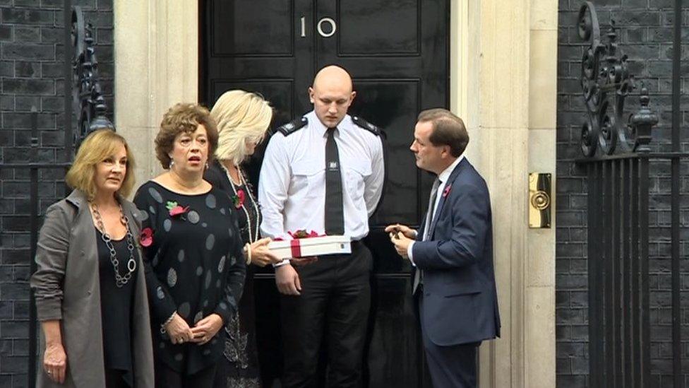 Campaigners handing in the petition
