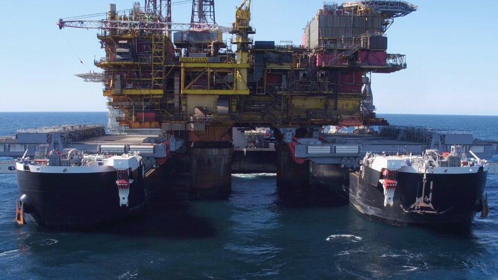 Allseas' Pioneering Spirit twin-hulled vessel lifting an entire oil rig off its legs