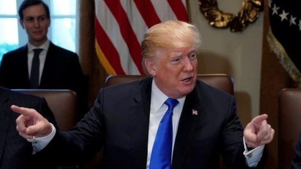 US President Donald Trump, flanked by Secretary of State Rex Tillerson and Defence Secretary James Mattis, at the White House, December 20, 2017