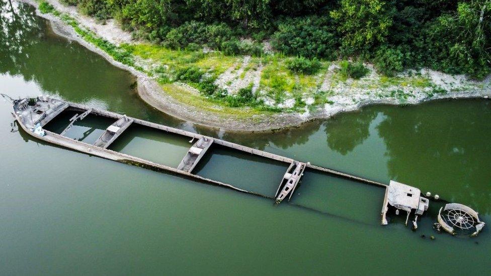 A partially-submerged barge