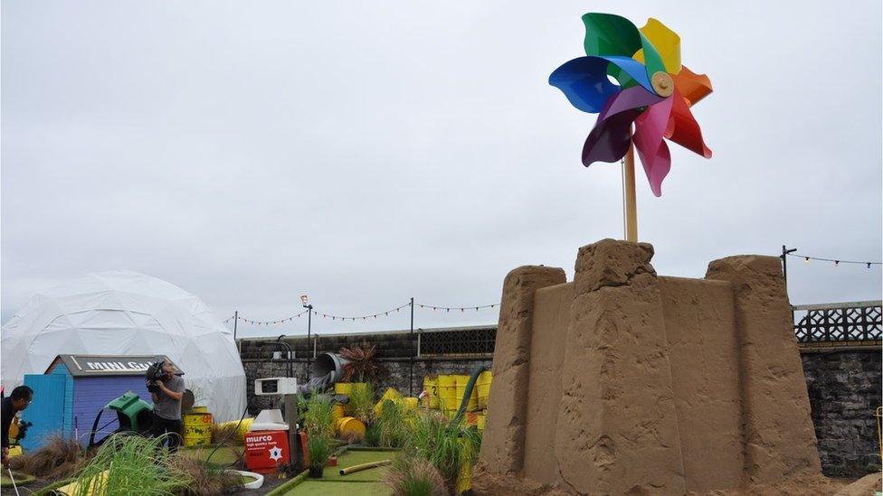 Giant pin wheel exhibit at Dismaland