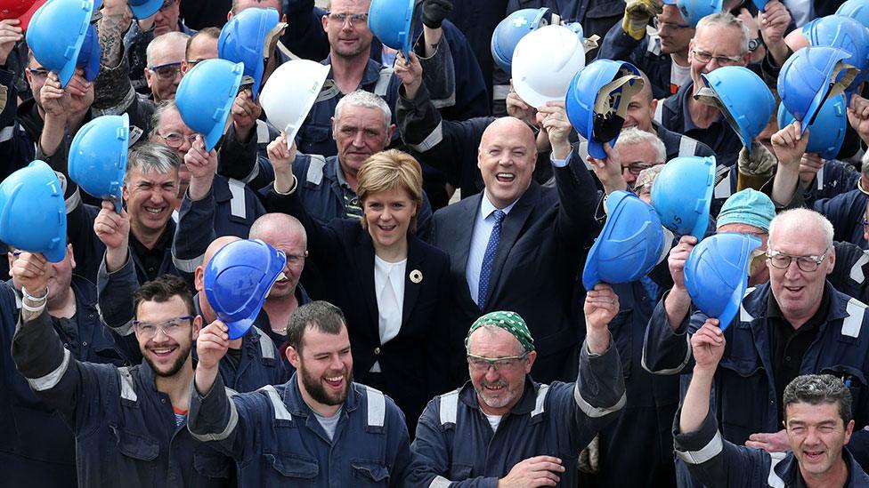 Nicola Sturgeon with shipyard workers in 2015