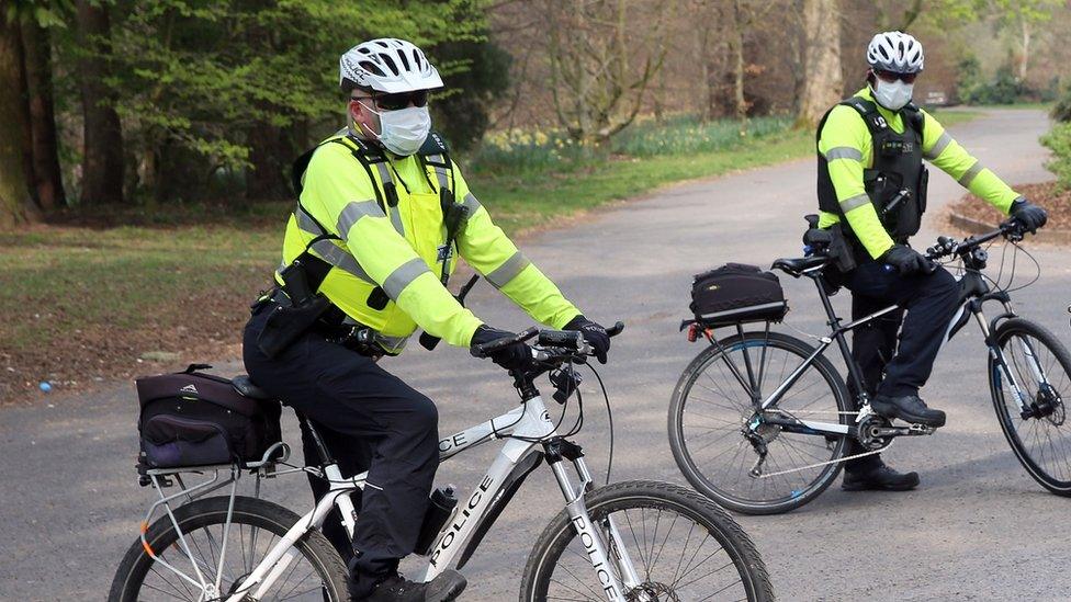 Police officers wearing face masks