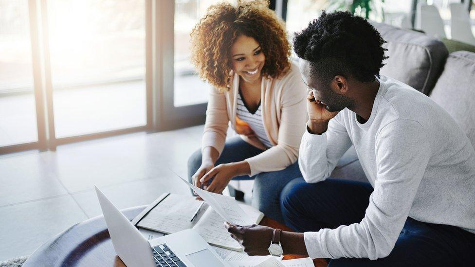 two people looking at computer