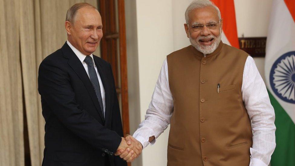 Indian Prime Minister Narendra Modi (R) greets Russian President Vladimir Putin (L) during a welcoming ceremony on October 5, 2018 in New Delhi, India. Vladimir Putin is on a two-day state visit to India.