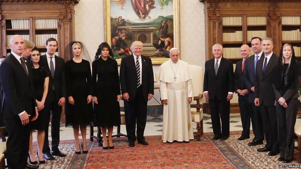 Trump with his aides and the Pope.