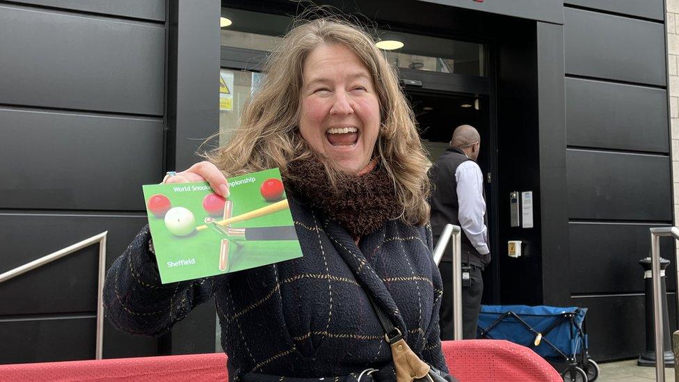 Lady holding snooker ticket